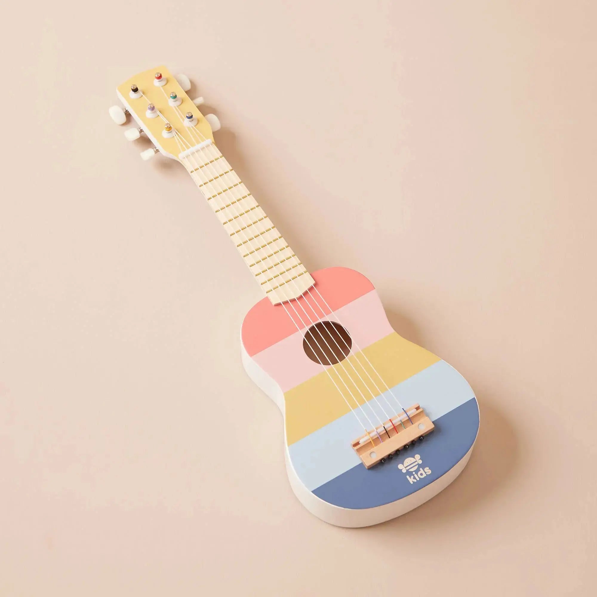 Spielzeug Gitarre aus Holz in sanften Pastellfarben für Kinder