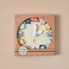 Holz Puzzle-Uhr mit Jahreszeiten und Zahlen in der Produktverpackung
