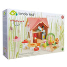 Magisches Holzpuppenhaus mit Puppen und Zubehör in der Produktverpackung